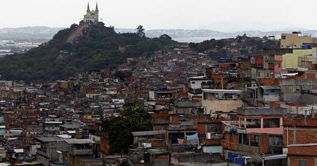 A general view of the Vila Cruzeiro slum in Rio de Janeiro, Brazil, Friday, Nov. 26, 2010. Military armored vehicles continued Friday carrying police and navy soldiers into the heart of gang strongholds, chasing gunmen into nearby shantytowns. At least 23 people have been killed in clashes since late Sunday, most of them suspected drug gang members, and police has arrested more than 150 people in raids on nearly 30 shantytowns in the northern and western parts of Rio.(AP Photo/Felipe Dana)